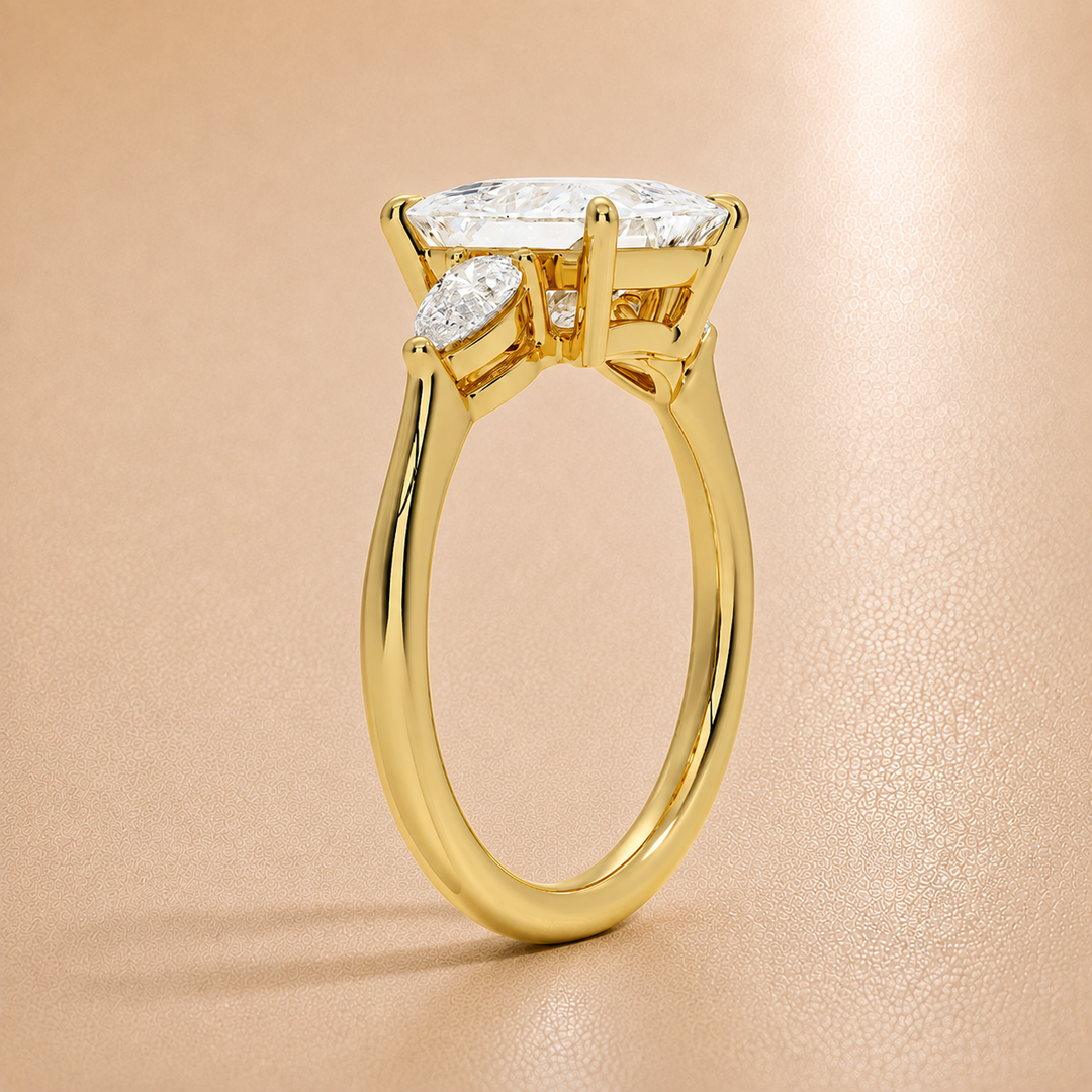Pear Triology Princess Engagement Ring in Yellow gold