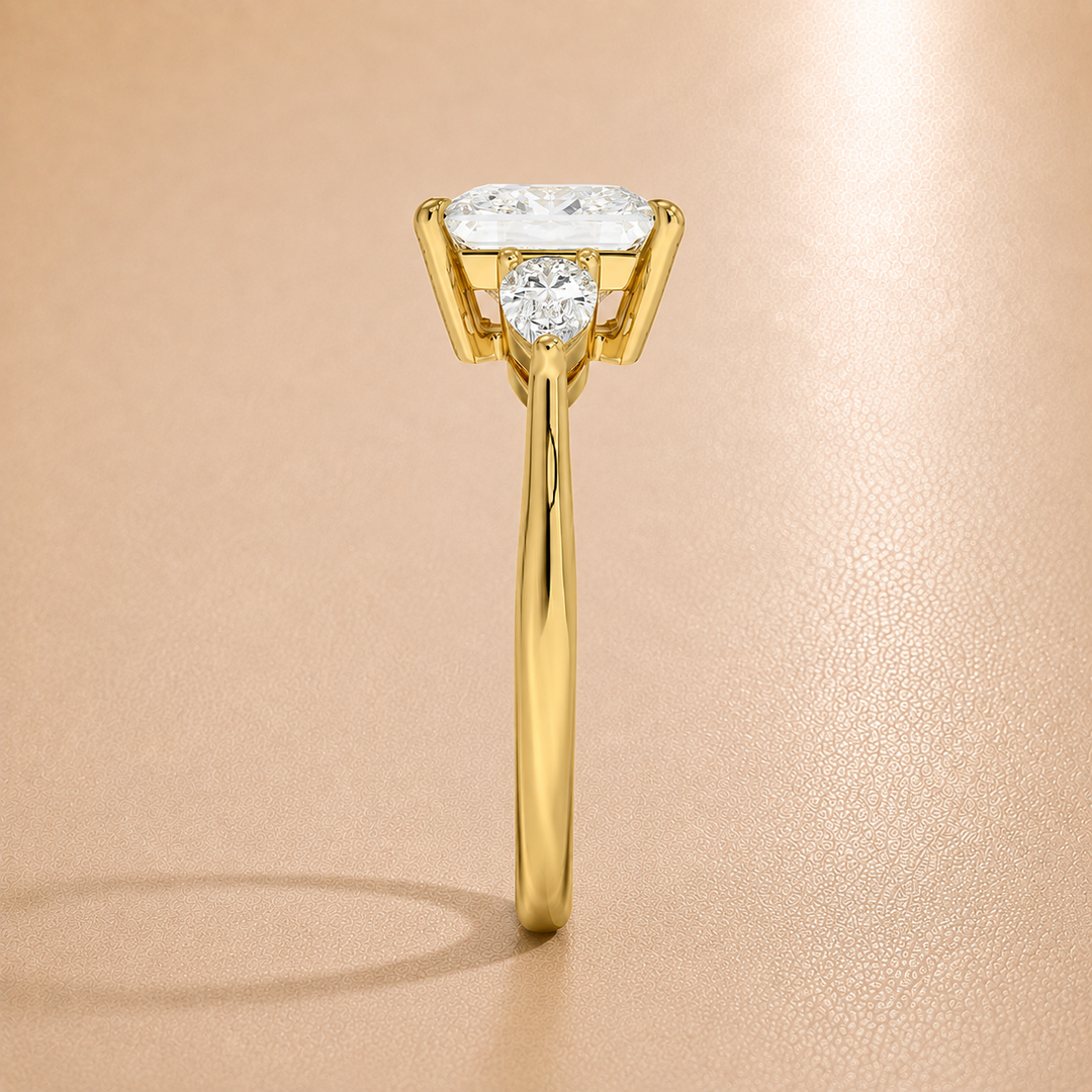 Pear Triology Princess Engagement Ring in Yellow gold